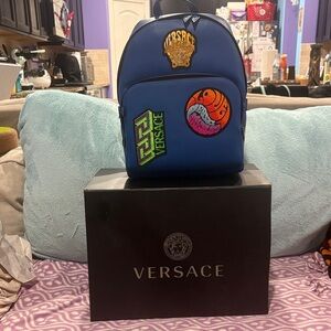 NEW UNUSED Versace Sapphrie Blue Backpack with Vibrant Embellishment Patches